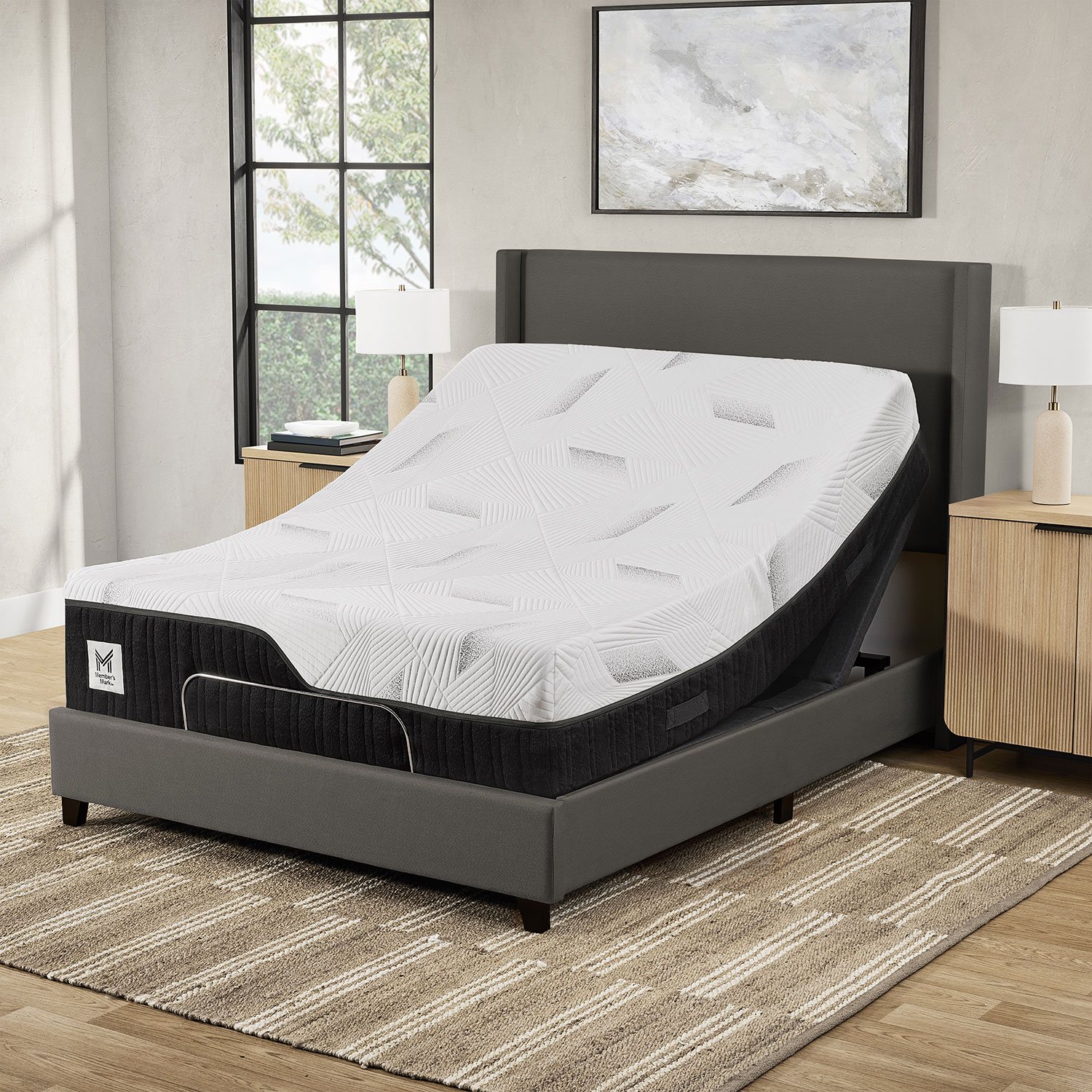 People sitting on bed with white bedding