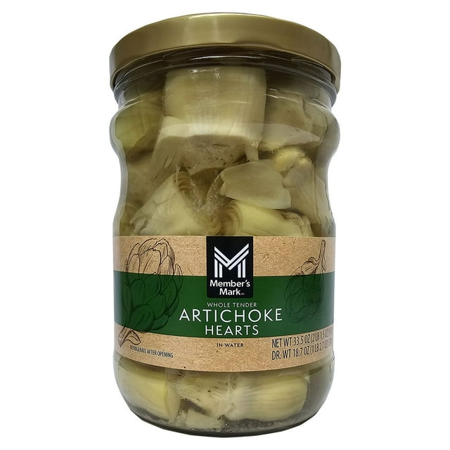 member's mark whole artichoke hearts, 33.5 oz. Centered front view of a 33.5 oz. Member's Mark glass jar of whole artichoke hearts packed in water with a gold metal lid; pale-green whole hearts visible through the jar and a tan-and-green label with the Member's Mark logo and 'Artichoke Hearts' text, a pantry canned vegetables staple often used for grilling, salads, or pasta.