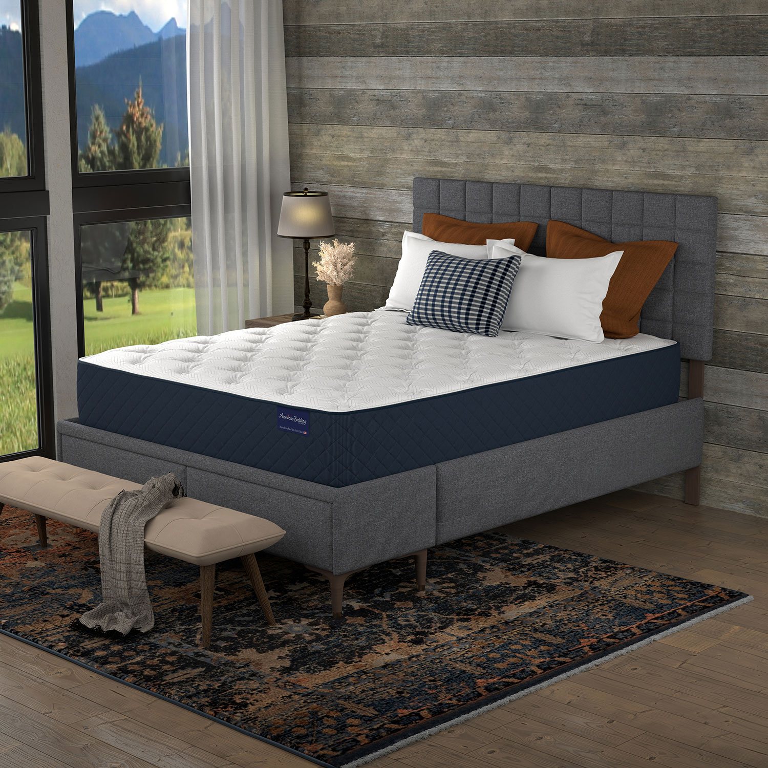 Side view of a king-size bed with mattress and headboard in a rustic room.
