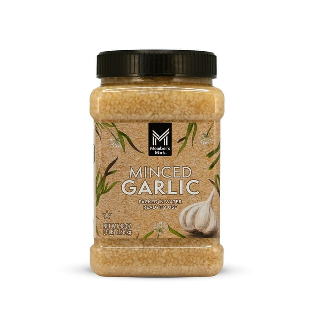 member's mark minced garlic, 48 oz. Centered front view of a clear 48 oz. jar with black screw lid showing pale minced garlic preserved in water; tan label with Member's Mark logo, garlic bulb illustration and "Minced Garlic" text, net wt. 48 oz. Table-ready seasoning for sautéing, marinades, grilling, and baking, 1/2 tsp ≈ one clove; often used as a convenient pantry staple for busy kitchens.