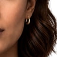 thumbnail image 5 of Diamond Cut Huggie Hoop Earring in 14K Gold, 5 of 6