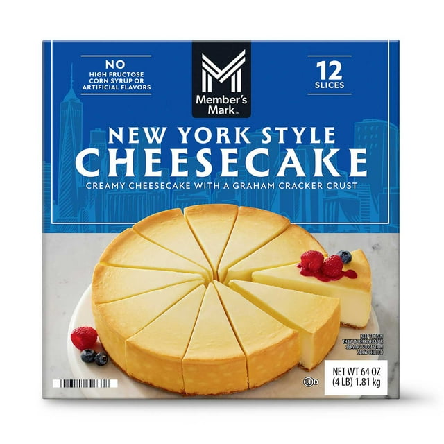 member's mark 9" new york style cheesecake, frozen, 12 slices front-facing pre-sliced cheesecake with one wedge slightly pulled out, parchment paper between slices visible, smooth pale-yellow cream cheese filling and golden-brown graham cracker crust, box art with Member's Mark logo and '12 slices' label, often used for parties and picnics.